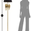 Lampe de sol dorée avec abat-jour en tissu noir et décor perroquets