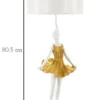 Lampe de table Dancer en métal et résine dorée abat-jour tissu blanc