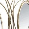 Panneau en métal doré avec cercles et miroirs