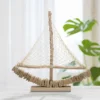 Sculpture voilier en bois voile tissu base bois massif